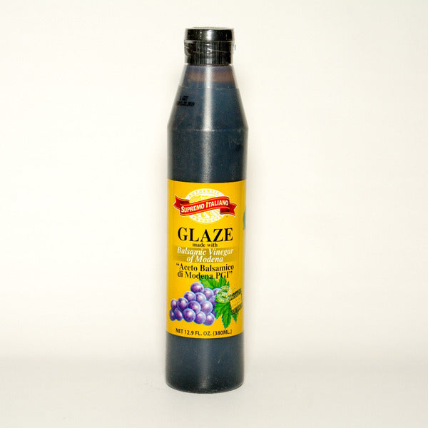 Bottle of glaze with a yellow label on a white background
