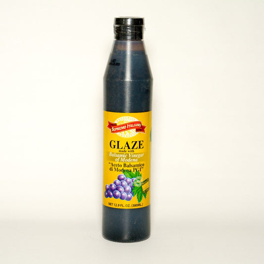 Bottle of glaze with a yellow label on a white background
