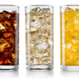 Glass of cola, fanta, sprite with ice cubes isolated on white. With clipping path